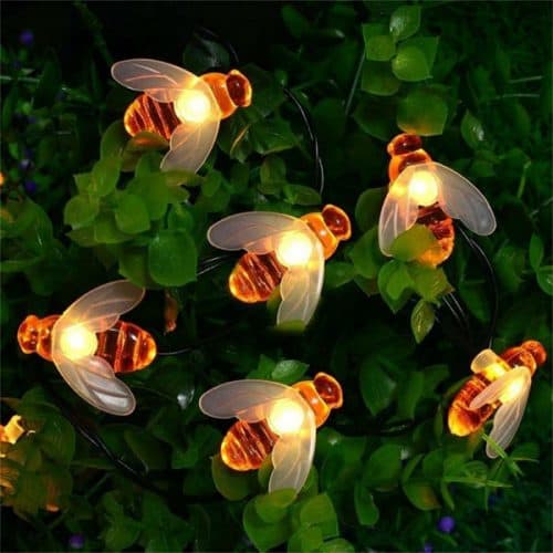 mini honey bee string lights on greenery 