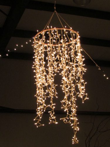 hanging circular frame with cascading fairy lights hanging down