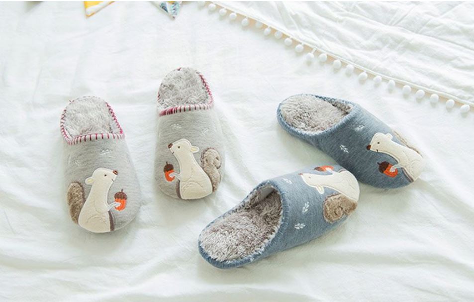 two pairs of slippers with squirrel motifs sewn on them for a cozy experience