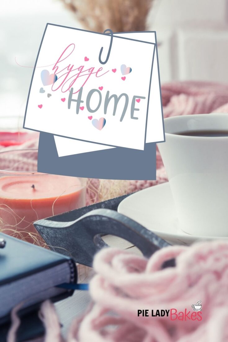 hygge home sticker on image with candles, tray, blanket, coffee mug book